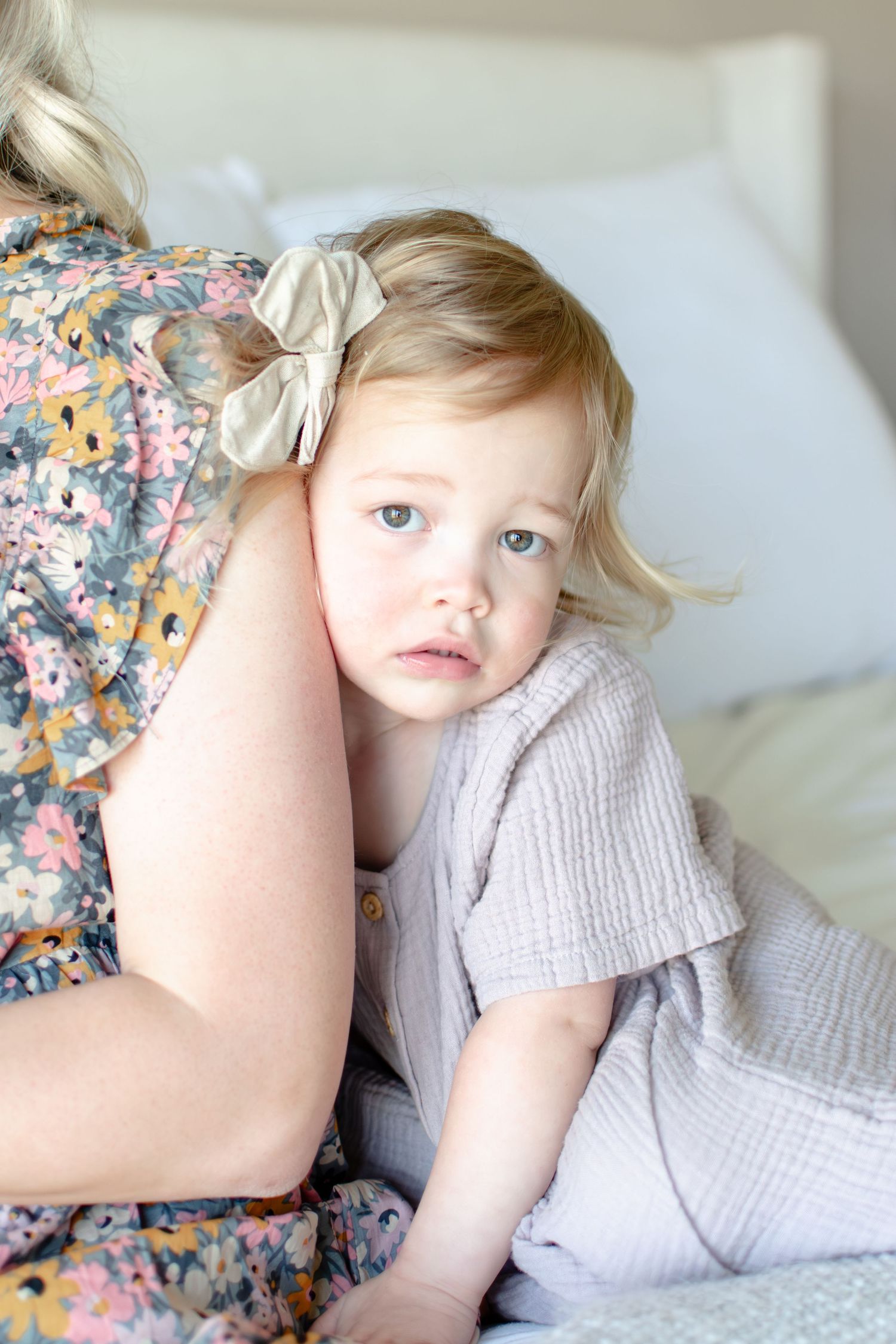 Big sister seeks the comfort of mom during the in-home newborn session.