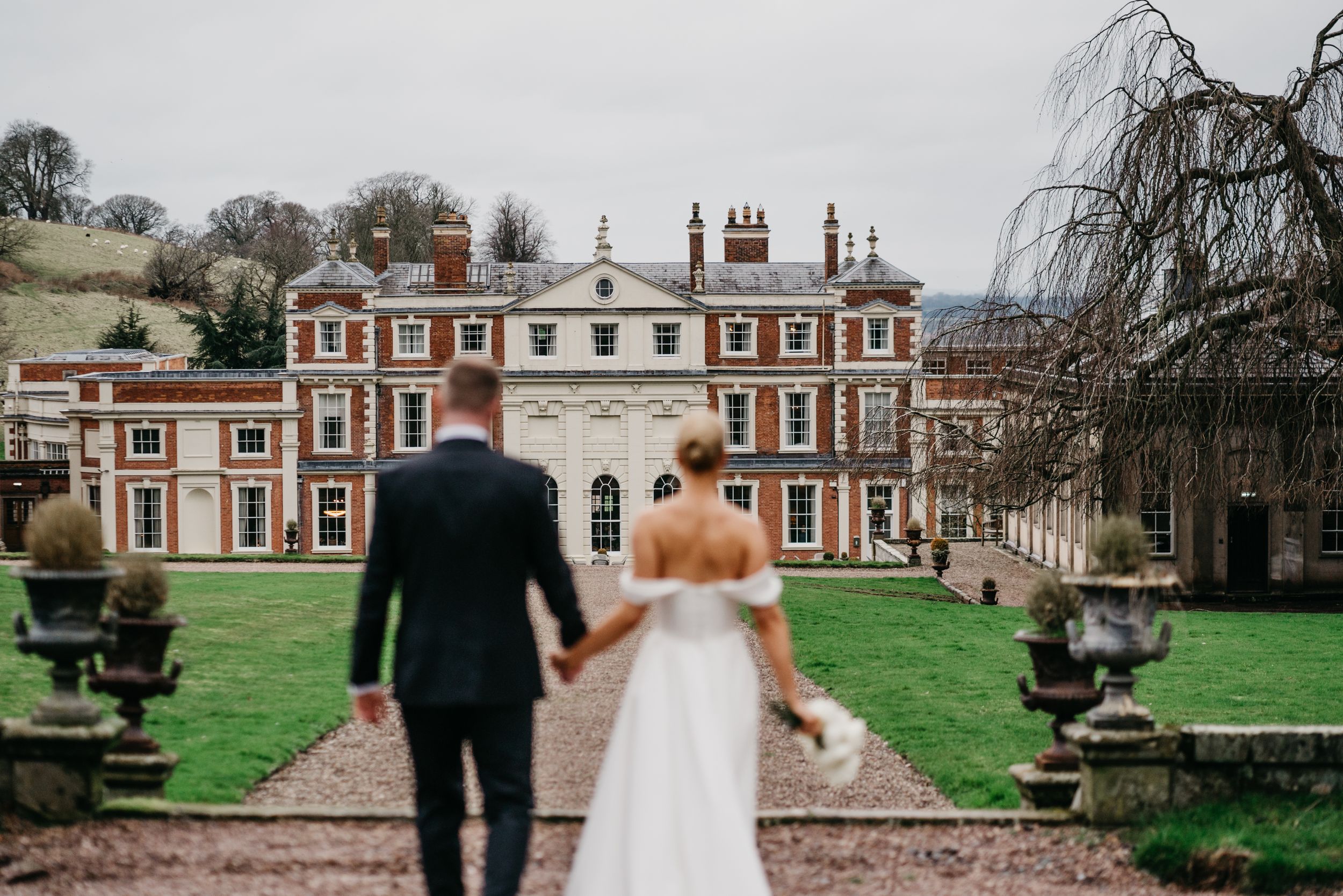 Bride and Groom walking at Hawkston Hall