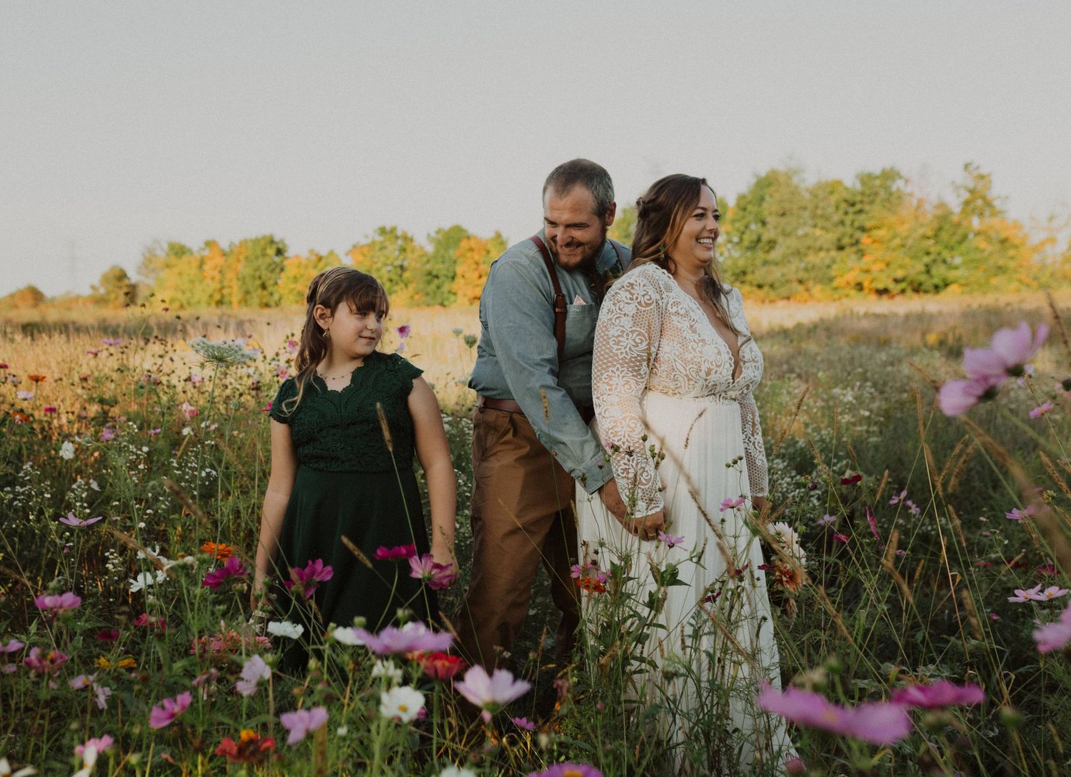 Romantic outdoor photography in a blooming wildflower meadow during golden hour.