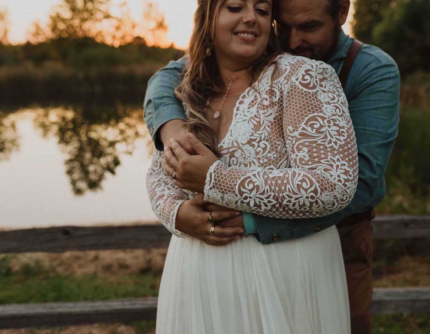 Intimate moments captured between a couple in wedding attire during sunset.