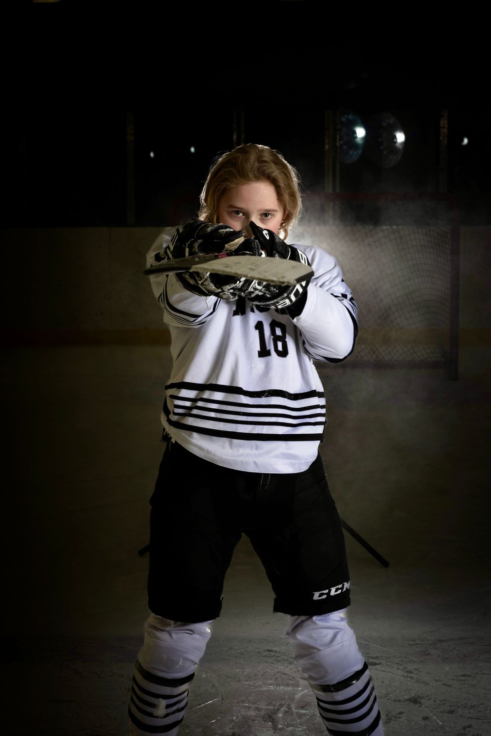 Niagara Knights player posing during an on ice session in Niagara
