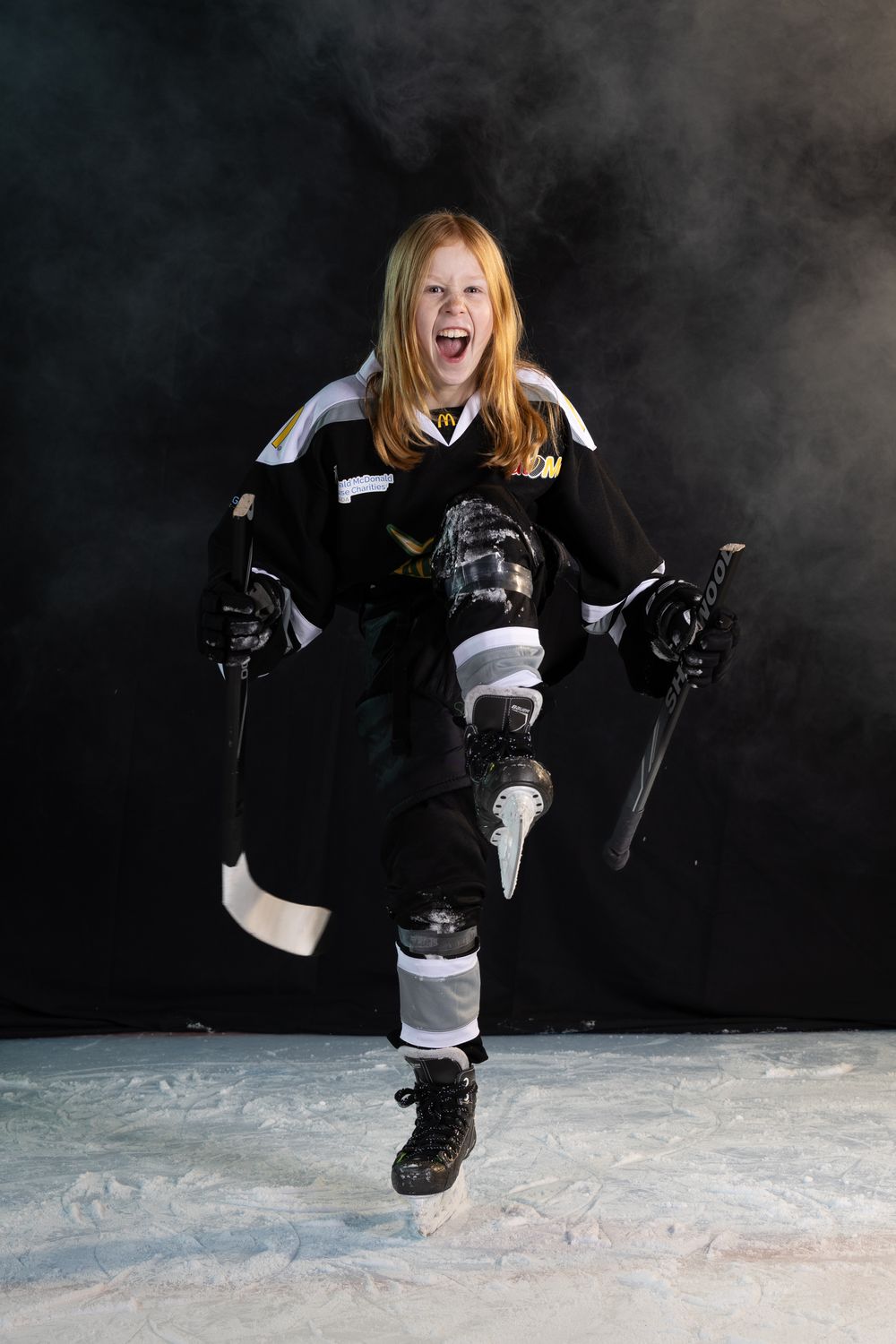 Stoney Creek Sabres Girls hockey player posing during on ice portrait session in Stoney Creek