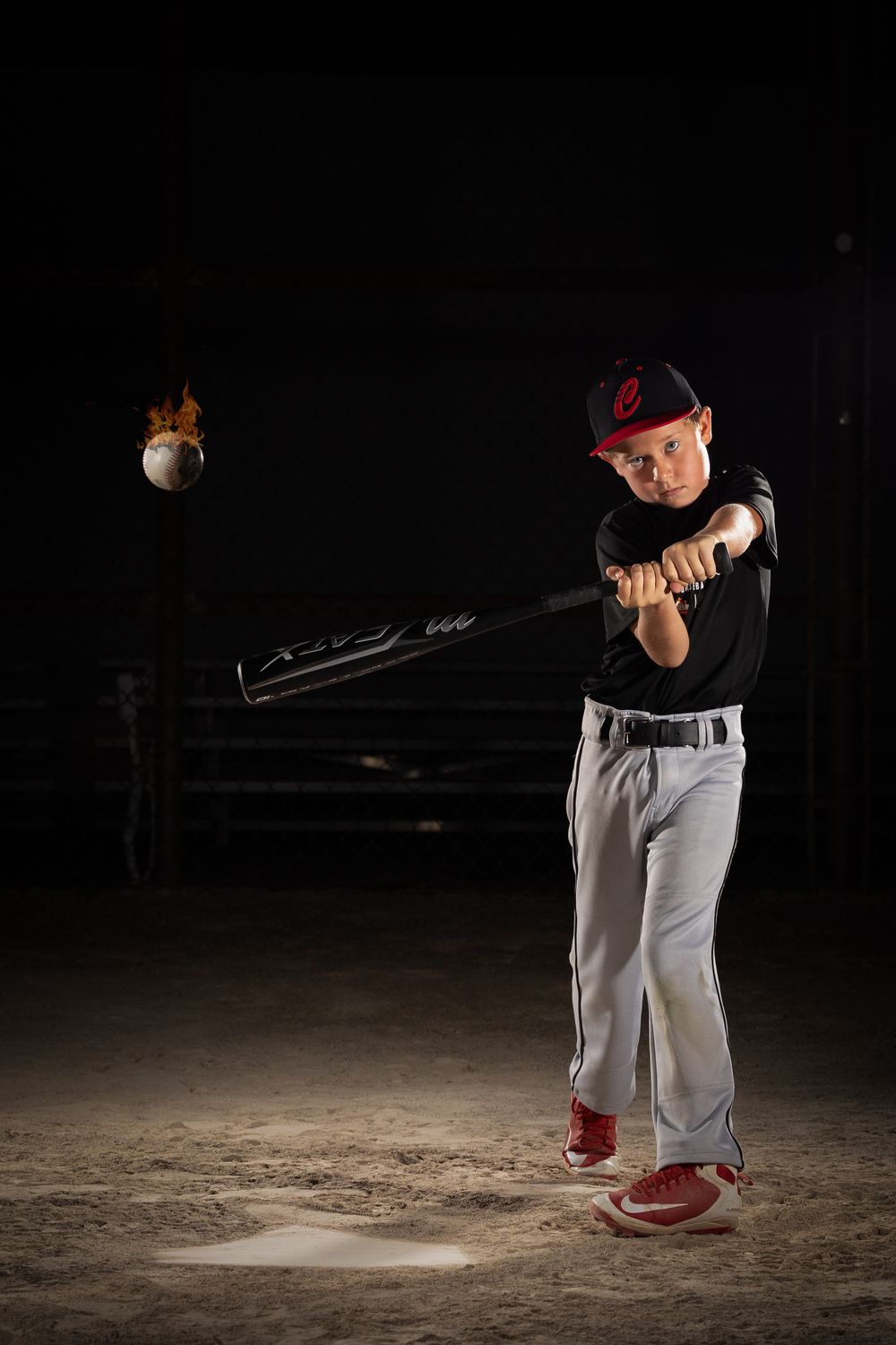 Grimsby Coyote Boys Baseball player posing for an outdoor portrait session in Grimsby Niagara