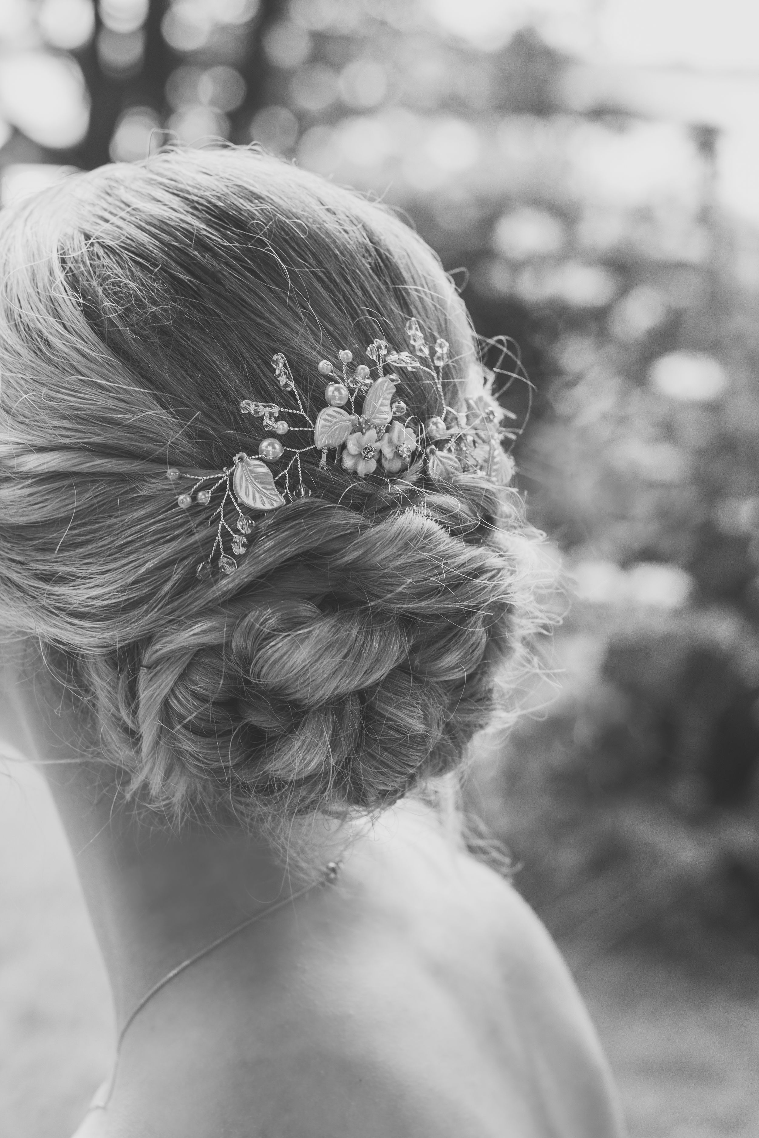 Black and white detail shot of a prom hair updo taken in Frost Park, Yarmouth, by Daneesha Williams