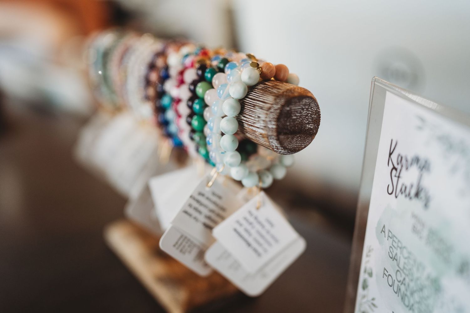 Decorative craft items with small tags displayed on a light surface.