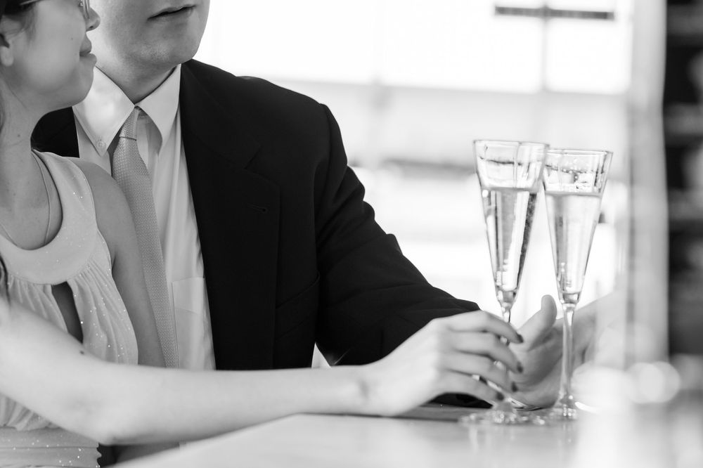 A row of cropped business meeting photos showing hands, drinks, and formal attire in an office setting.