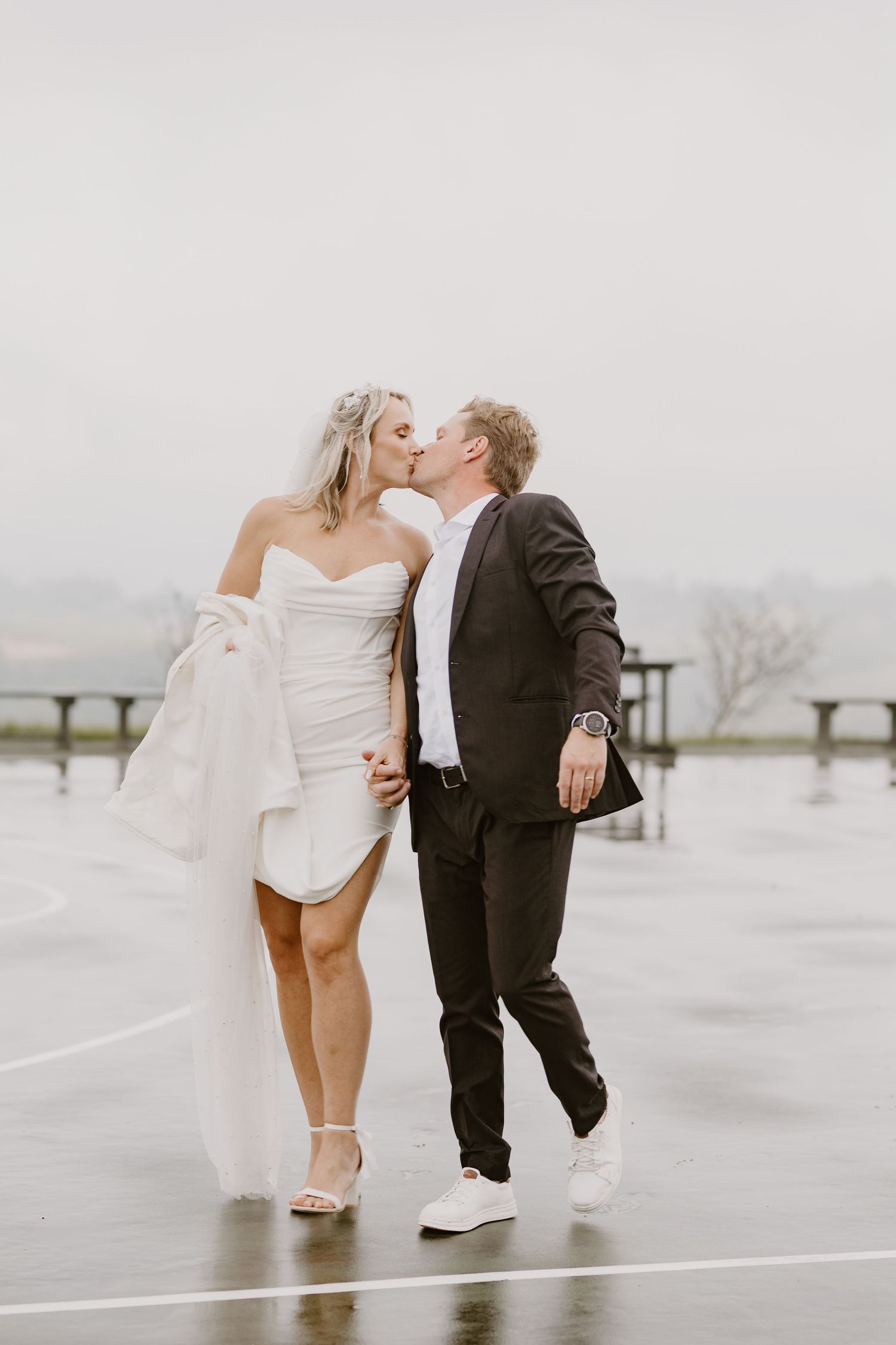 Bride and groom on bridge