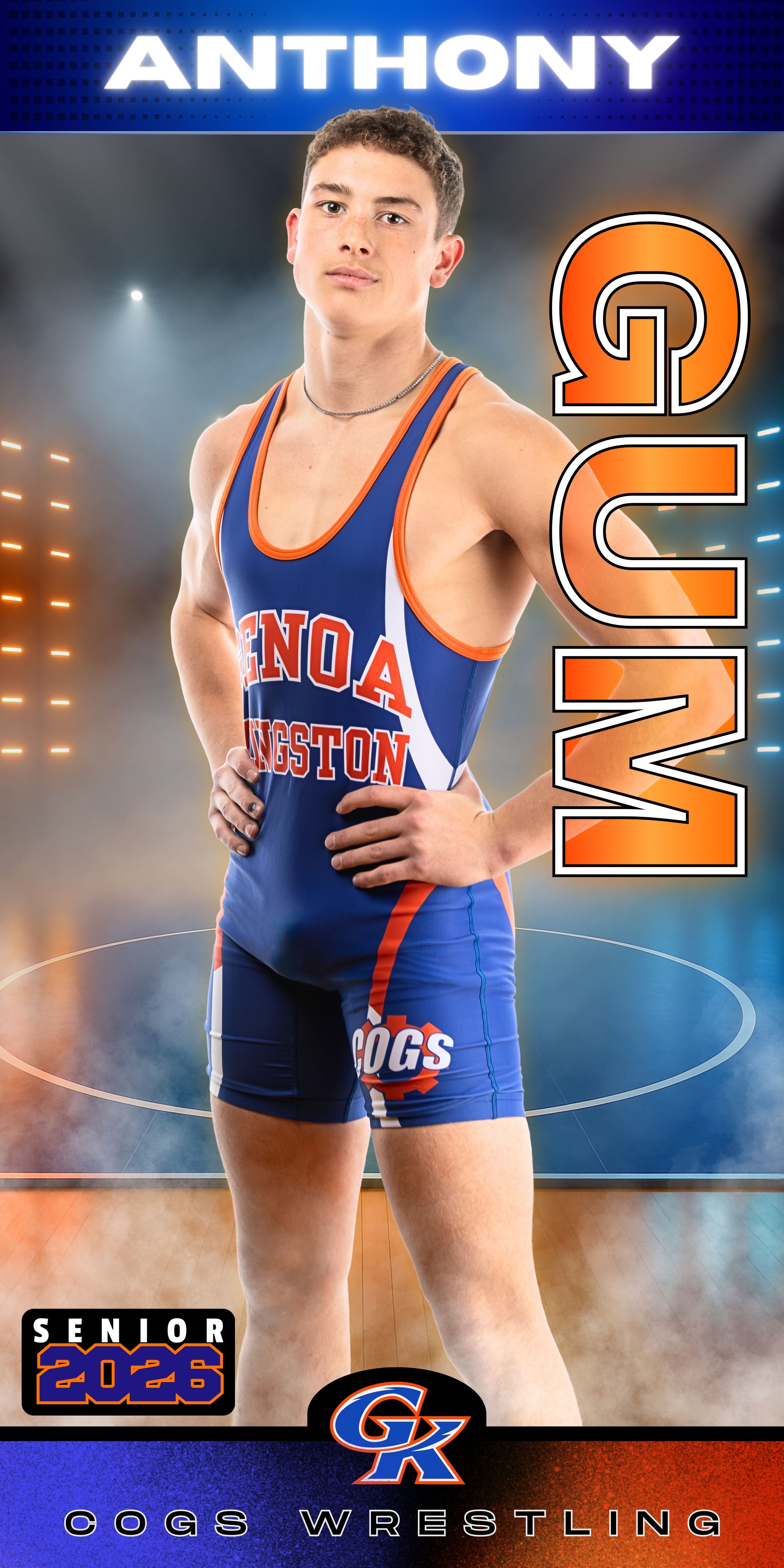 High school wrestler poses in blue and orange singlet against dramatic lighting and blue background for senior portraits.