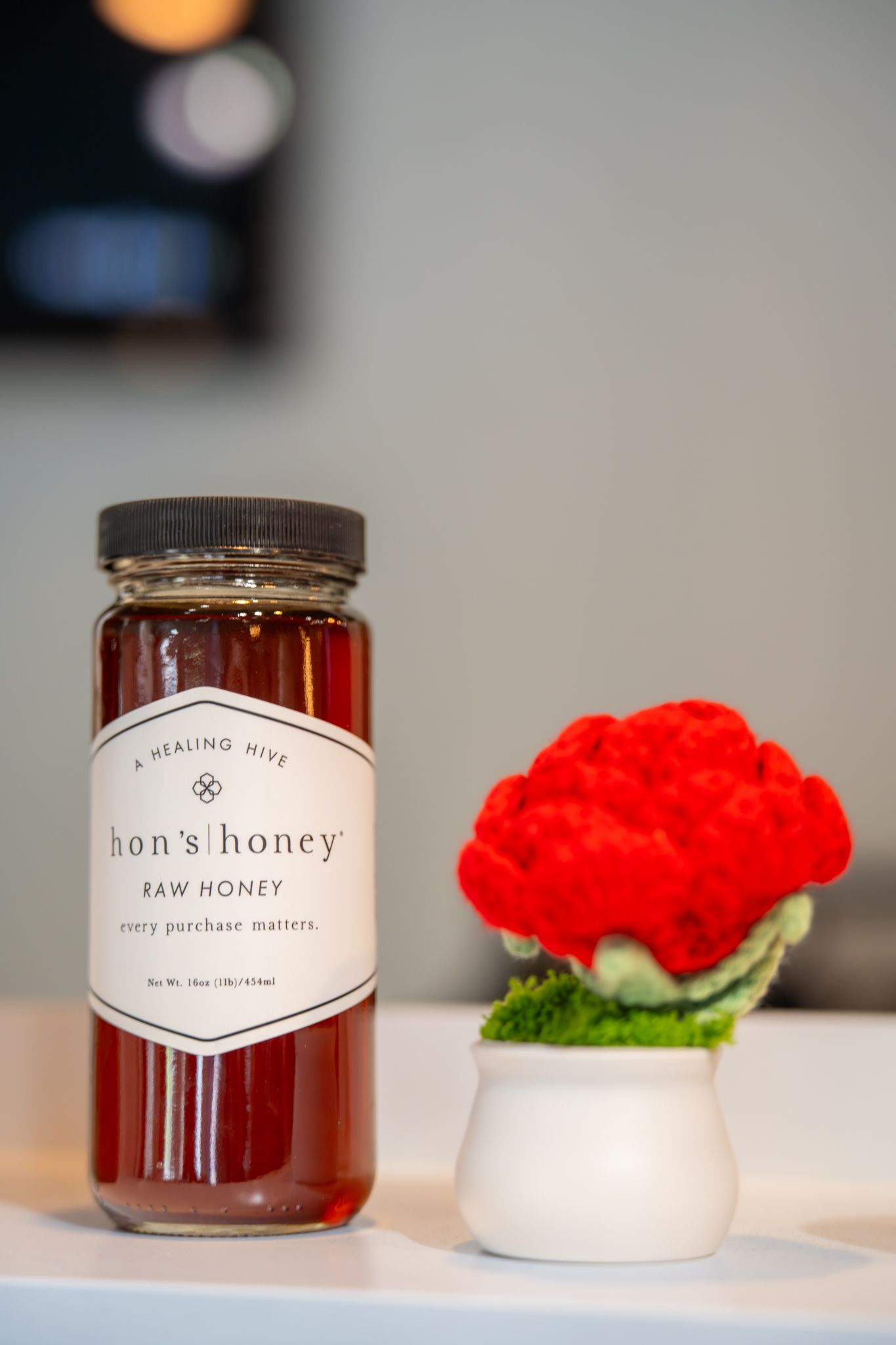 A honey jar labeled 'Son's Honey'. Quad Cities Product Photography at Argrow's House Davenport, IA