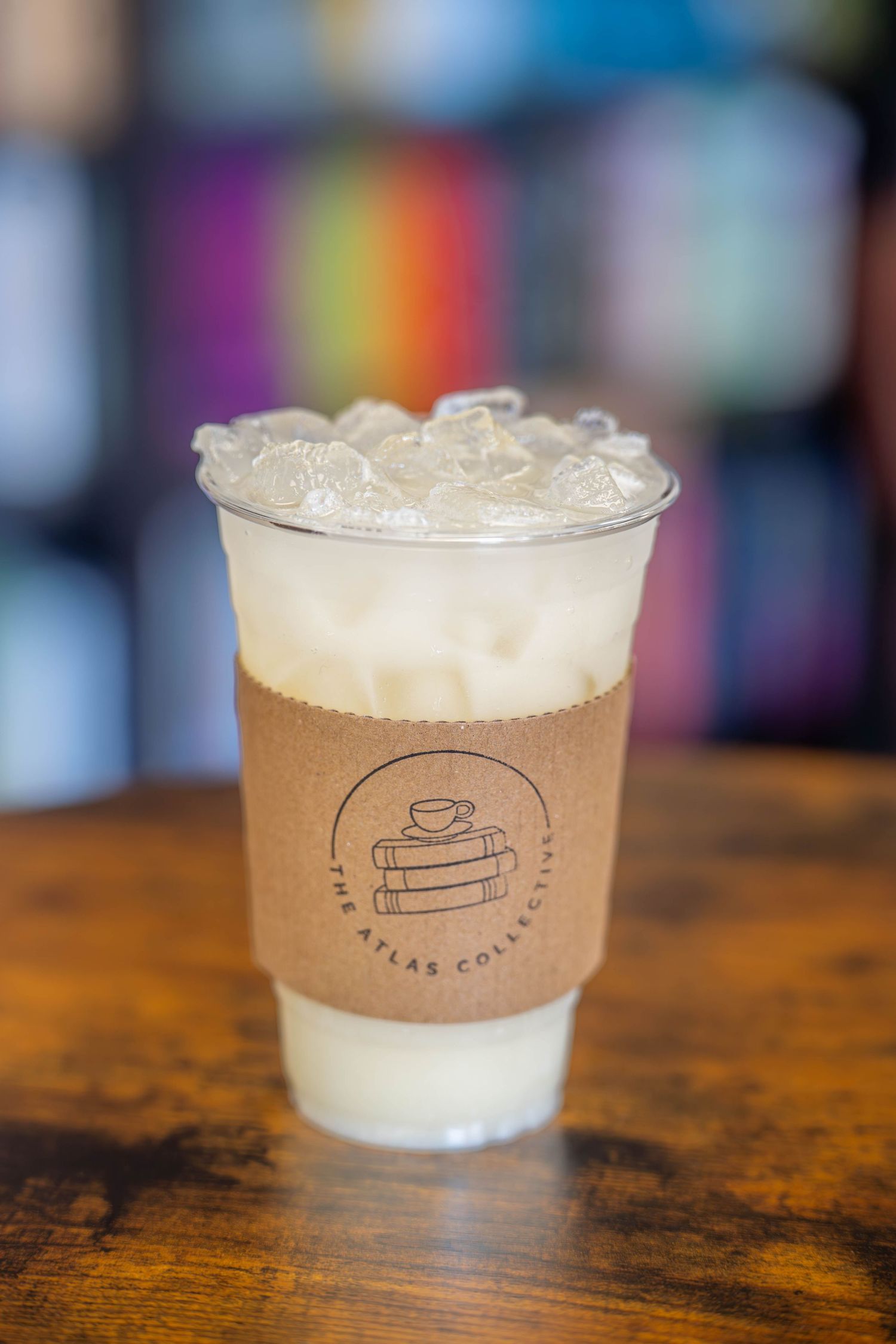Iced drink Atlas Collective Coffee logo sleeve on wooden Quad Cities Product Food Photography