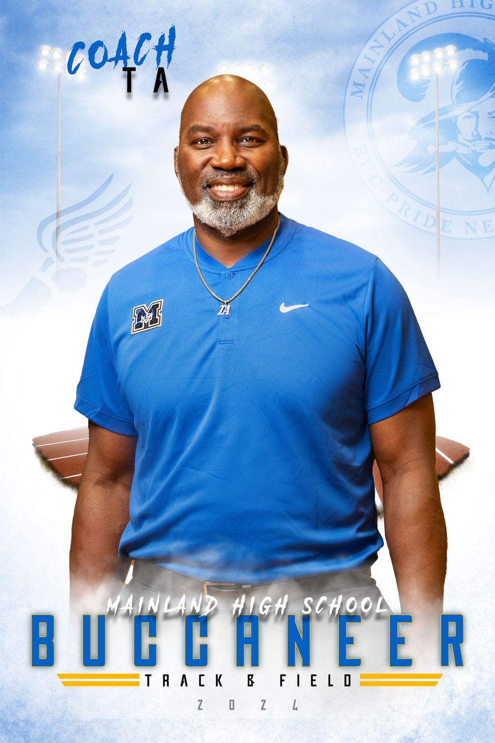 Track and field coach in blue Nike shirt smiles while wearing a necklace in professional portrait.