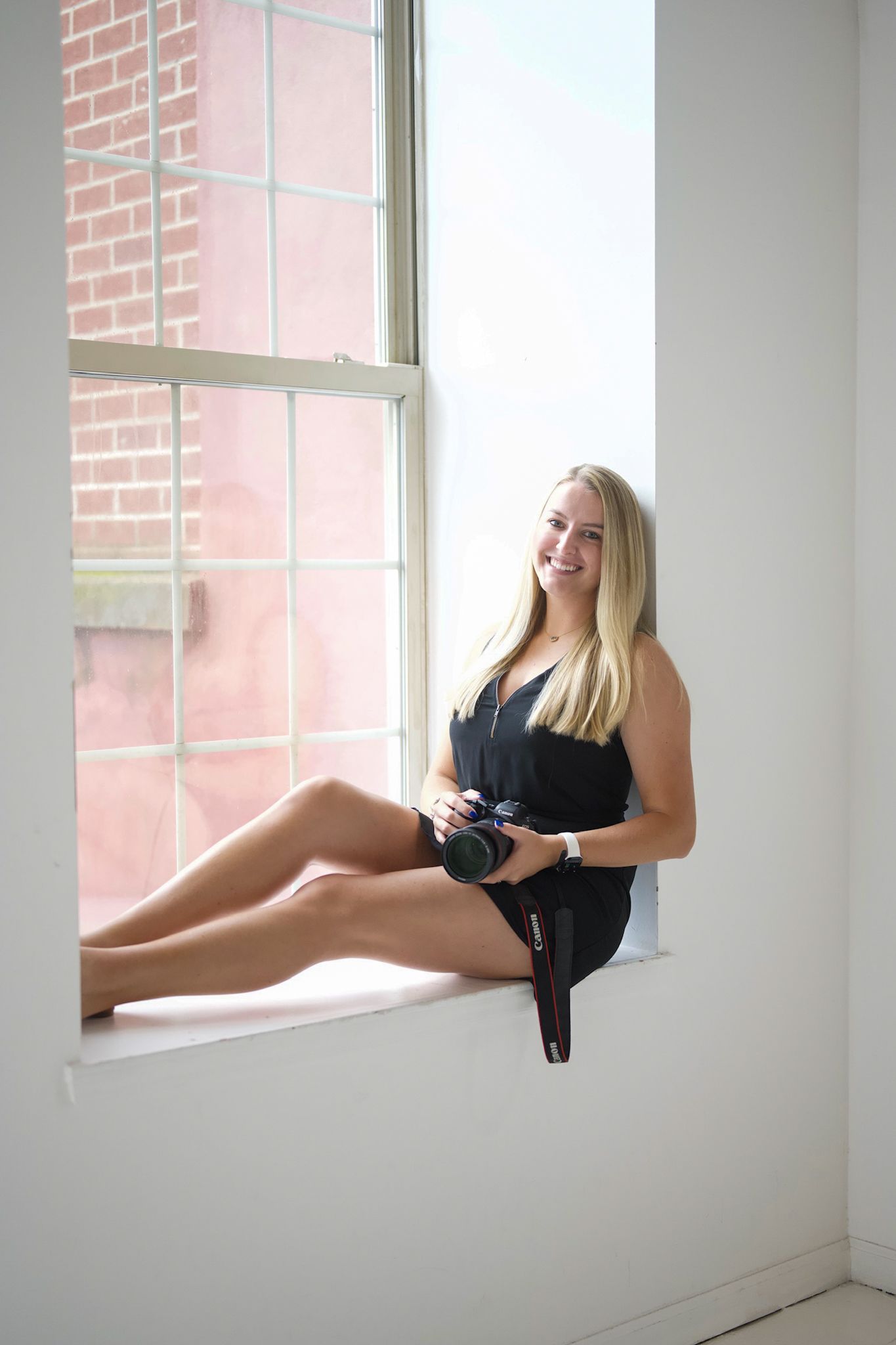 Creative portrait series by window showing dynamic poses in natural light.