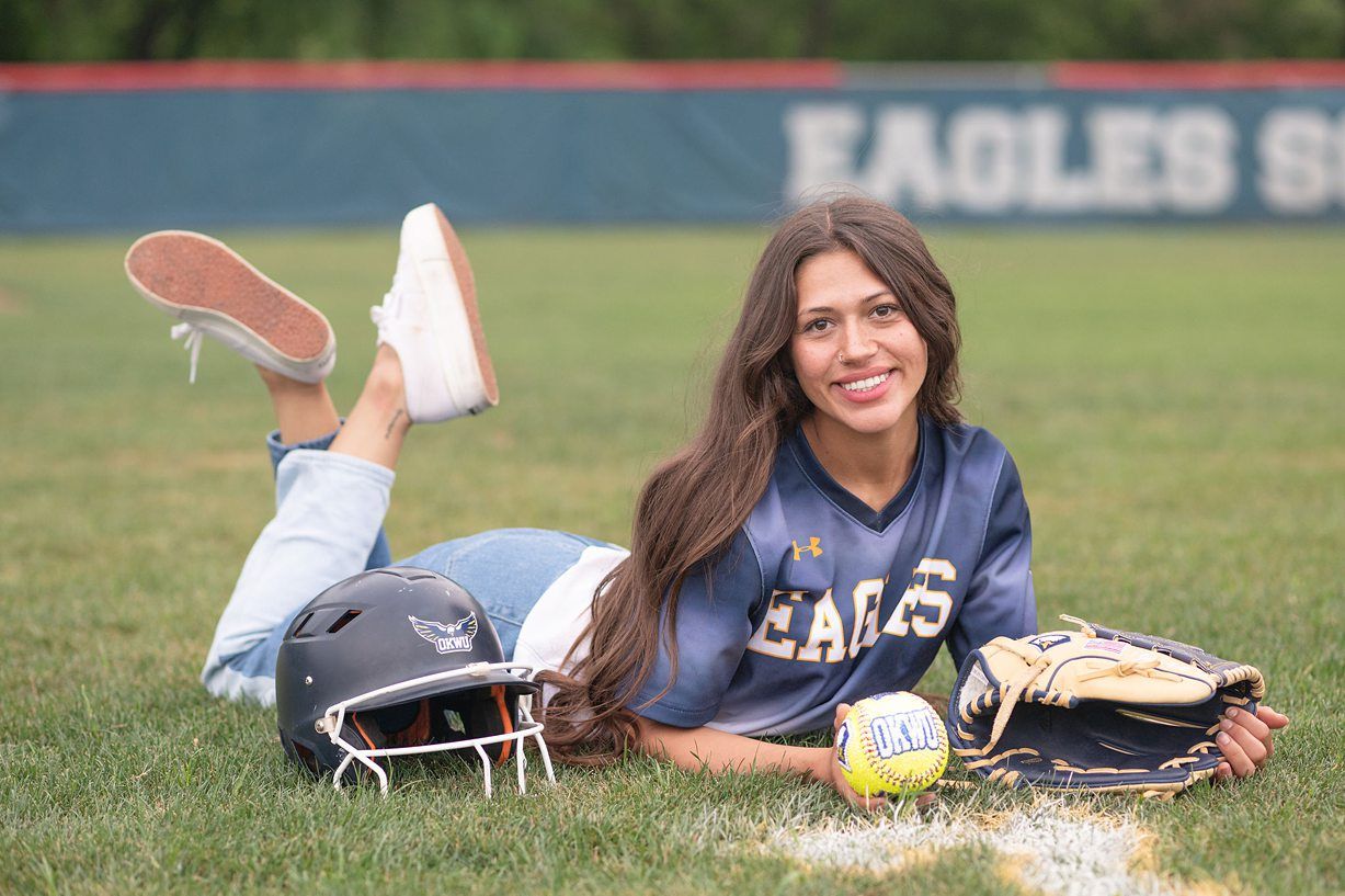 college senior girl portrait session on the OKWU softball field by Kristi Bray Photography