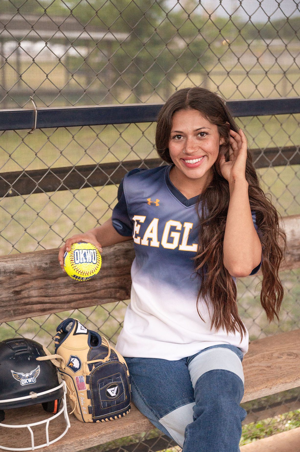 college senior girl portrait session on the OKWU softball field by Kristi Bray Photography