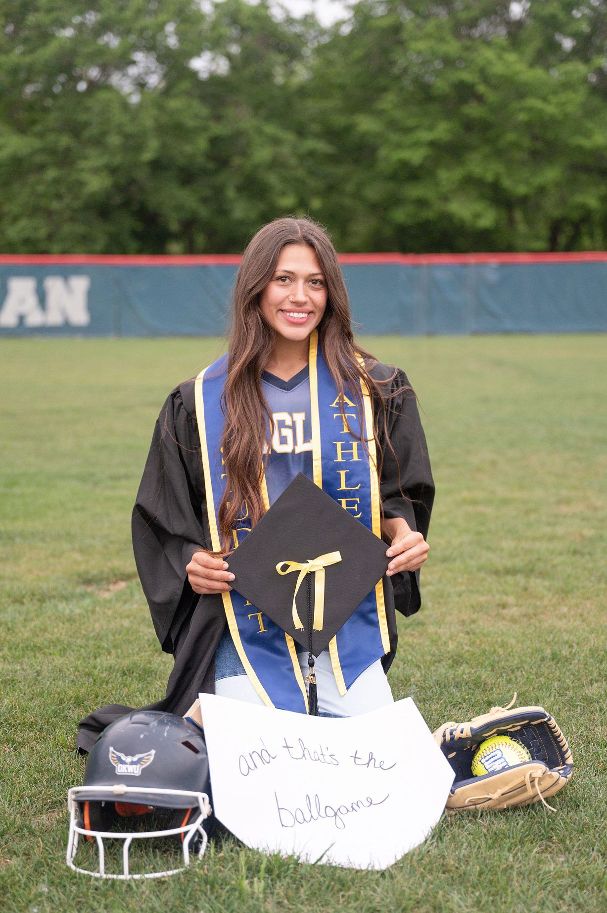 college senior girl portrait session on the OKWU softball field by Kristi Bray Photography