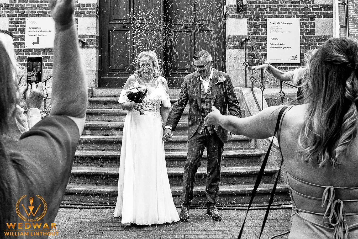 A celebratory moment captured on church steps during a wedding ceremony.