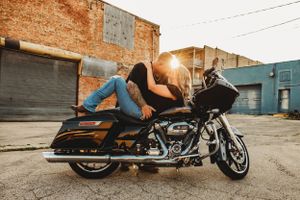 Series of motorcycle photos against an industrial backdrop at sunset.