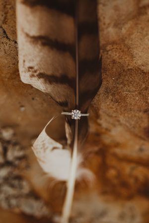 Close-up macro shot of an engagement ring with textured background.