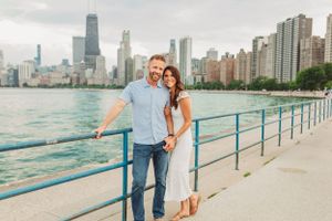 Romantic couple photos with Chicago skyline and Lake Michigan backdrop.