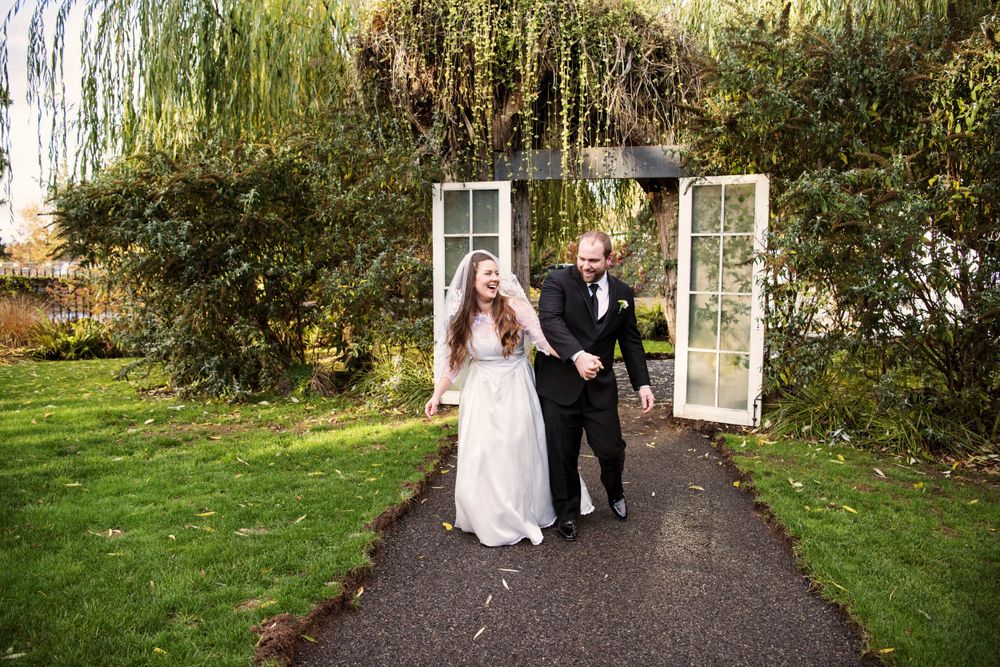 Bride and groom bumping hips