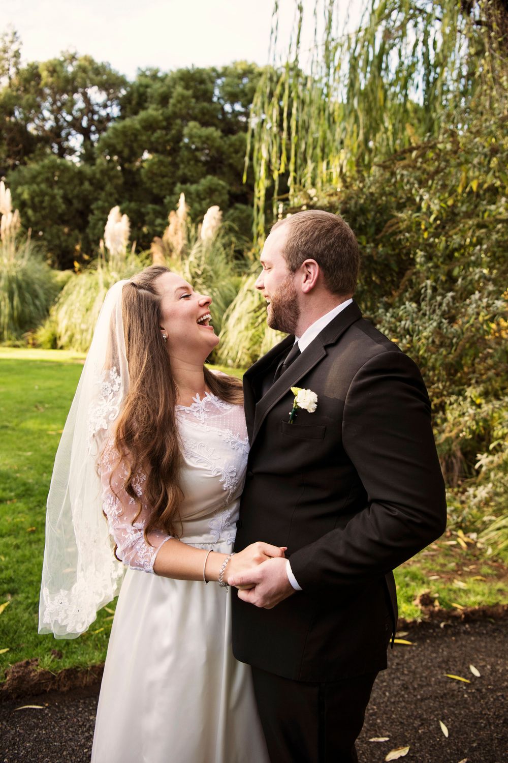bridal couple laughing together