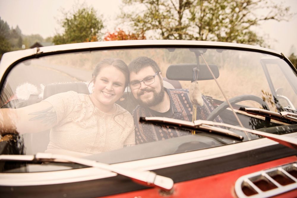 Bride and groom in the getaway car