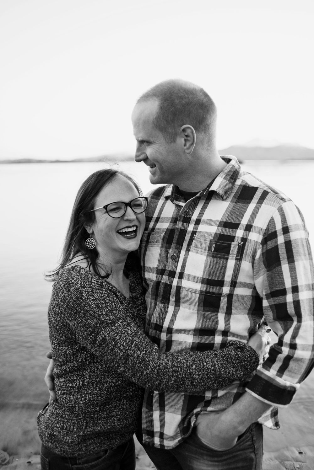 husband and wife laughing together