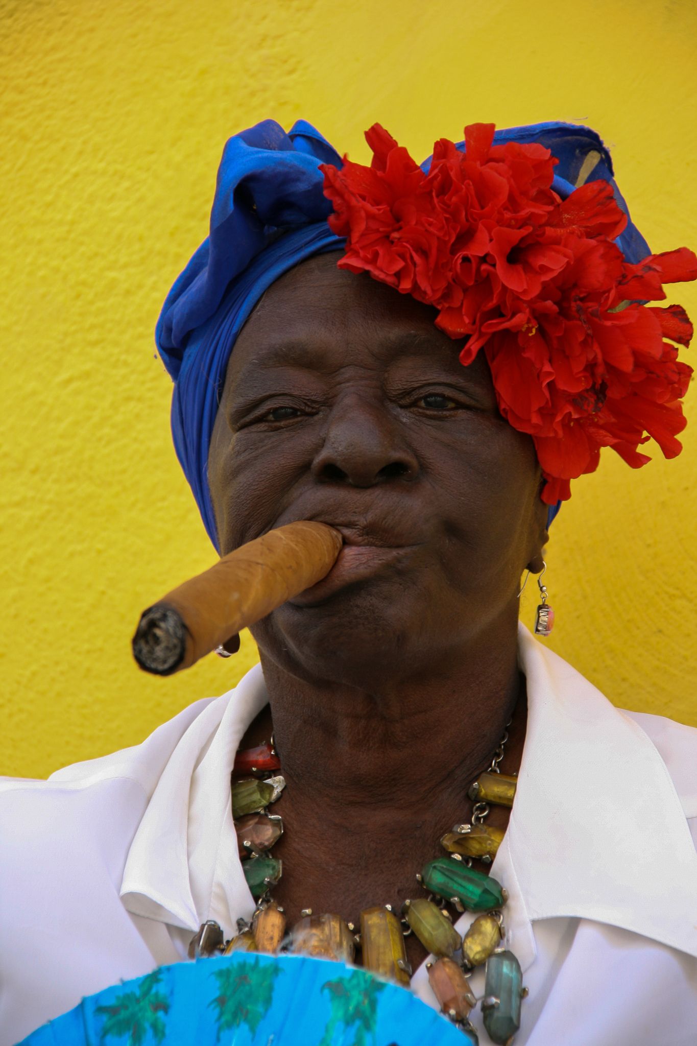 Cuban woman posing with her hand-rolled cigar Havana Cuba