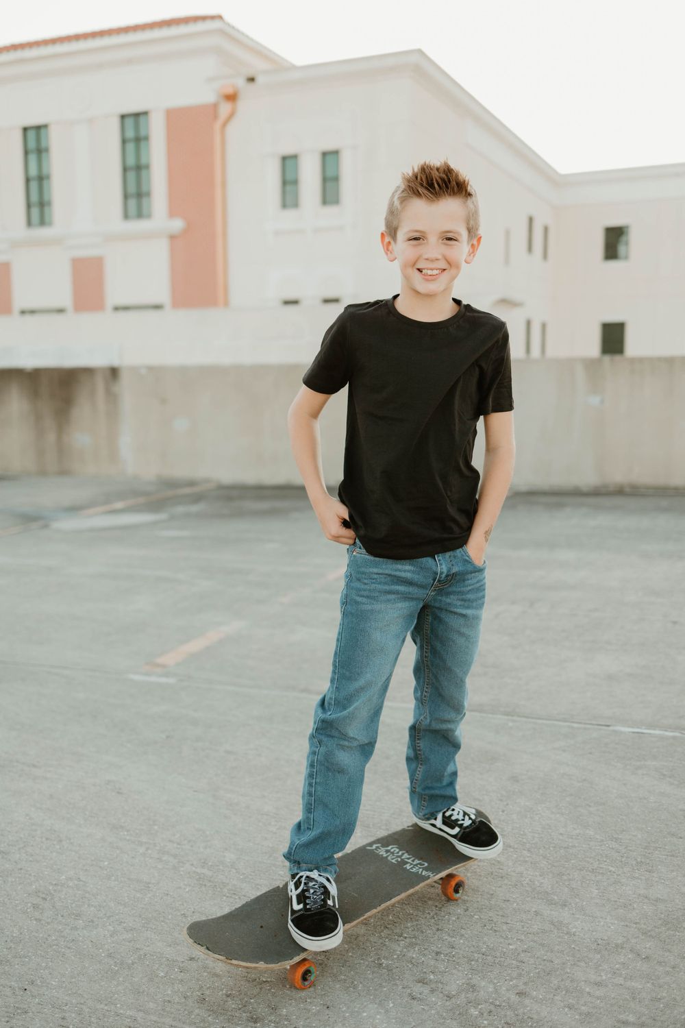 A skateboarding sequence showing basic stance and balance practice on a concrete surface.