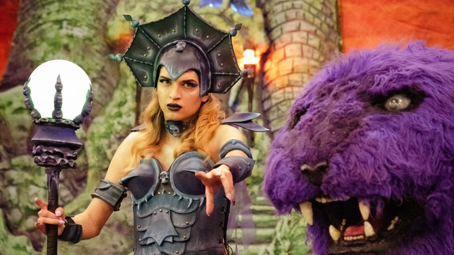 Fantasy themed photoshoot with purple creature costumes and medieval props.