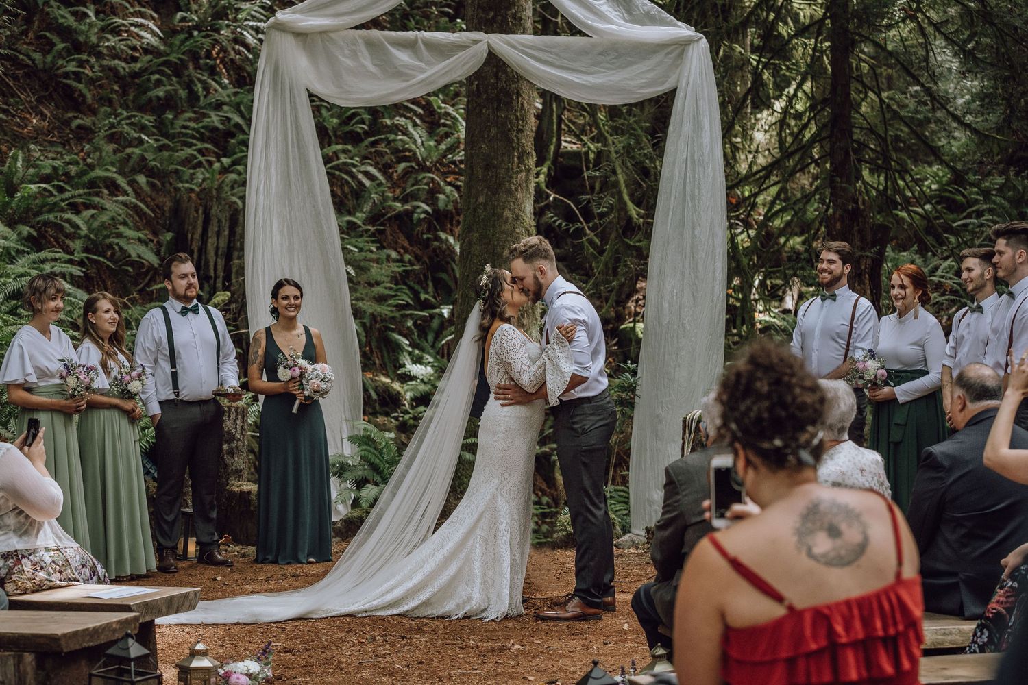Couple first kiss in Vancouver Island forest