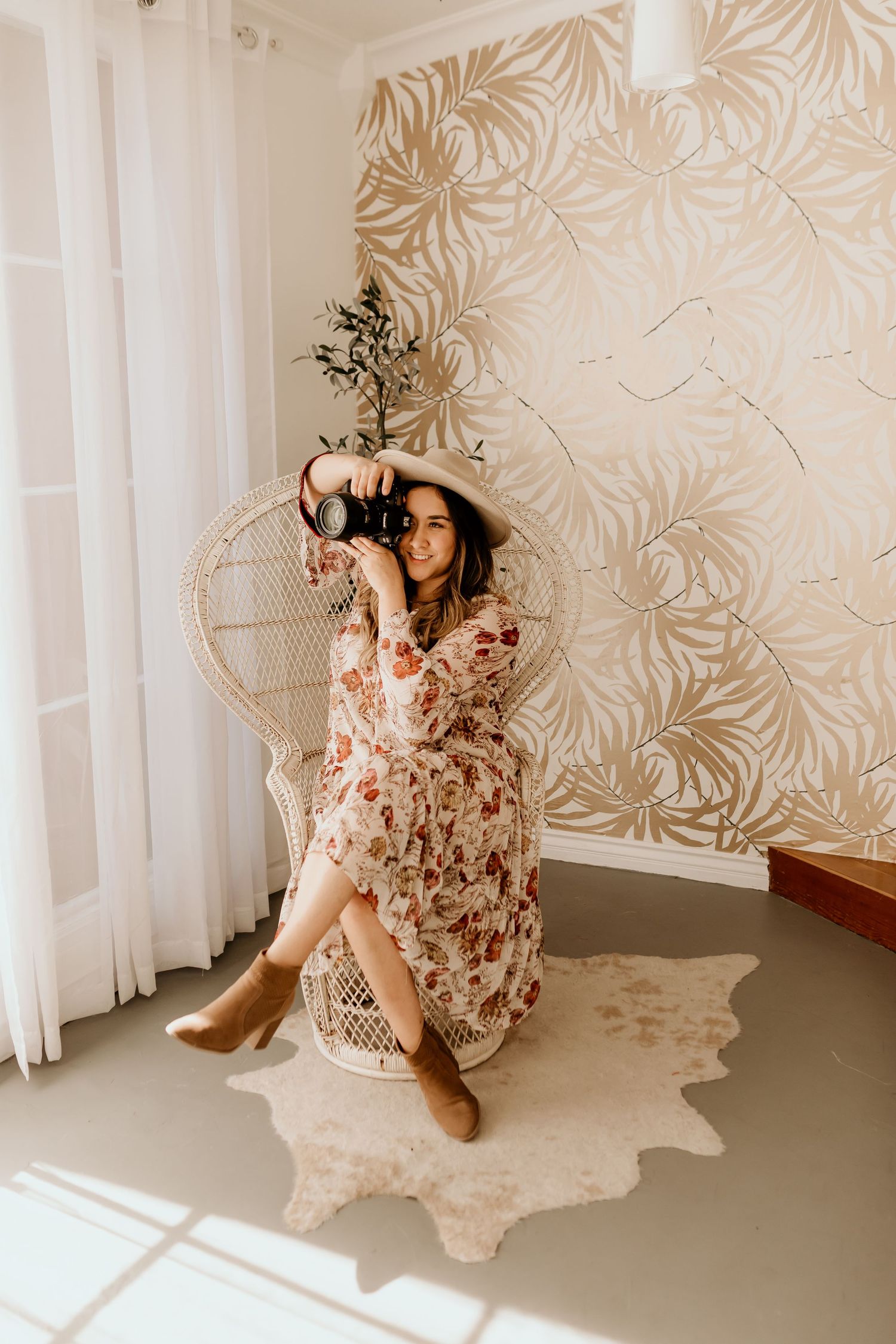 Stylish interior scene with floral wallpaper and soft natural lighting creating an elegant atmosphere.