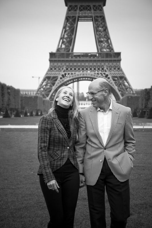 A couple taking a romantic stroll in Paris, with the Eiffel Tower as their backdrop
