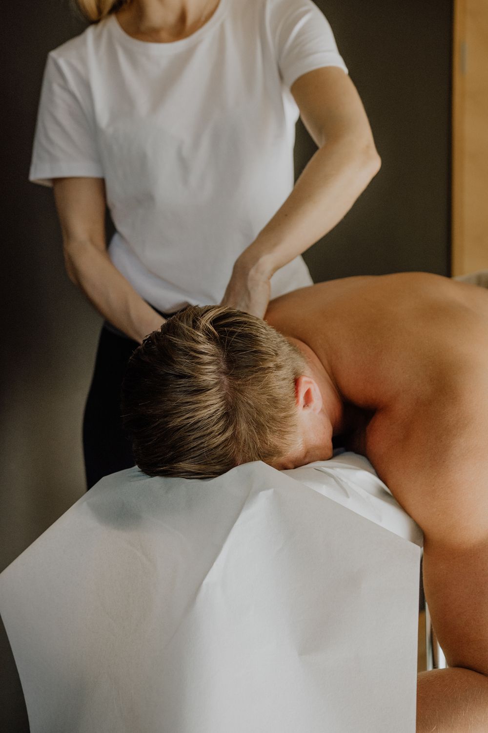 Professional massage therapy session in progress at wellness spa.