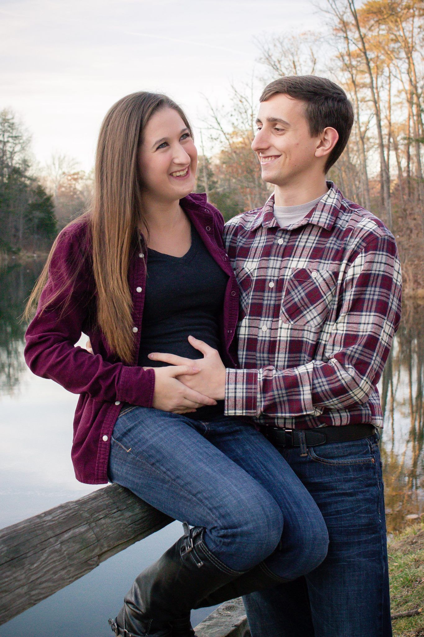 Couple smiles in maternity session at Sherando Park in Stephen's City, VA