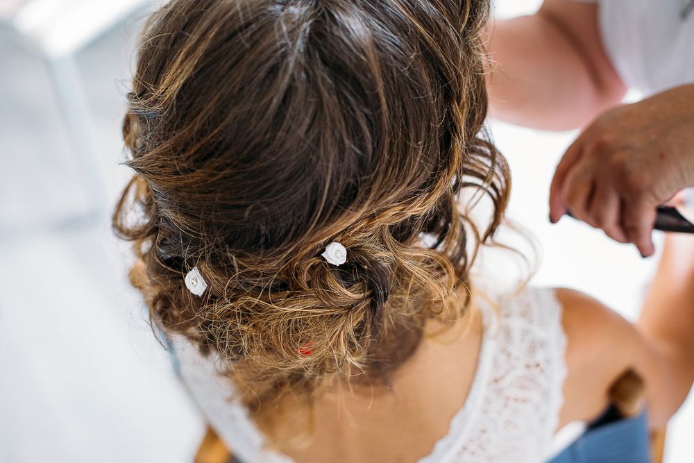 Delicate bridal hairstyle adorned with crystal hair accessories.