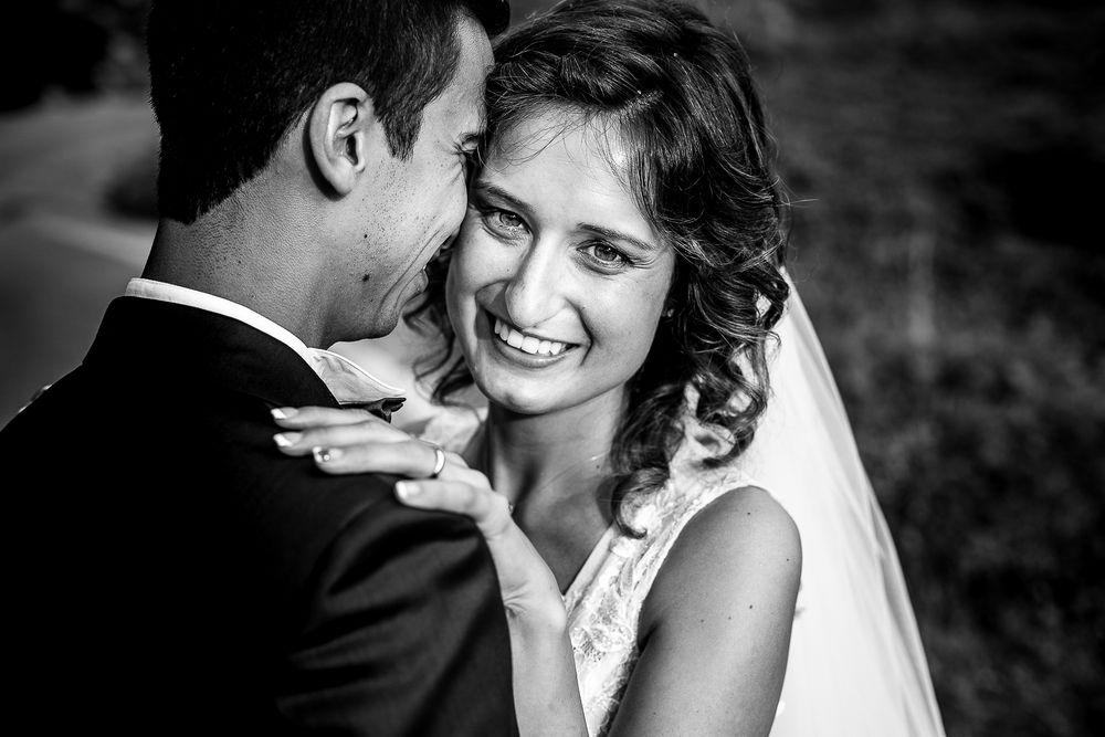 Intimate black and white portrait of joyful moments between newlyweds.