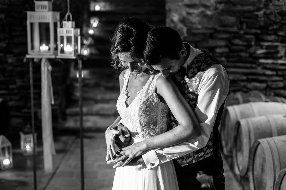 A romantic moment captured in black and white as a couple embraces in an intimate dance.