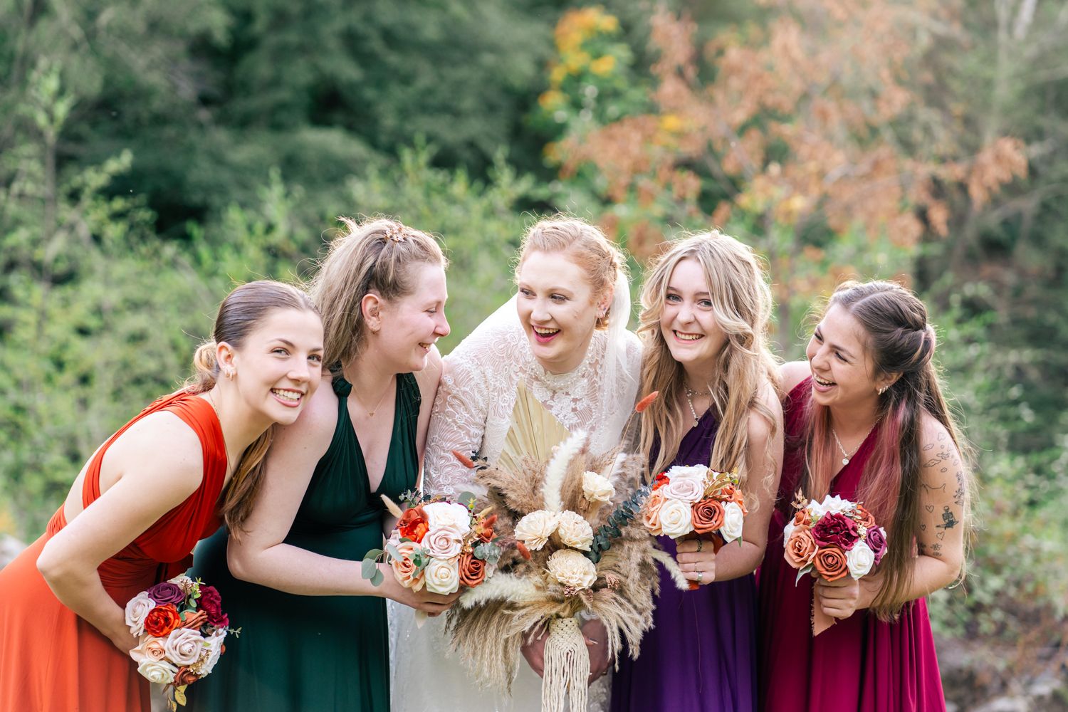 bride laughs with her bridesmaids