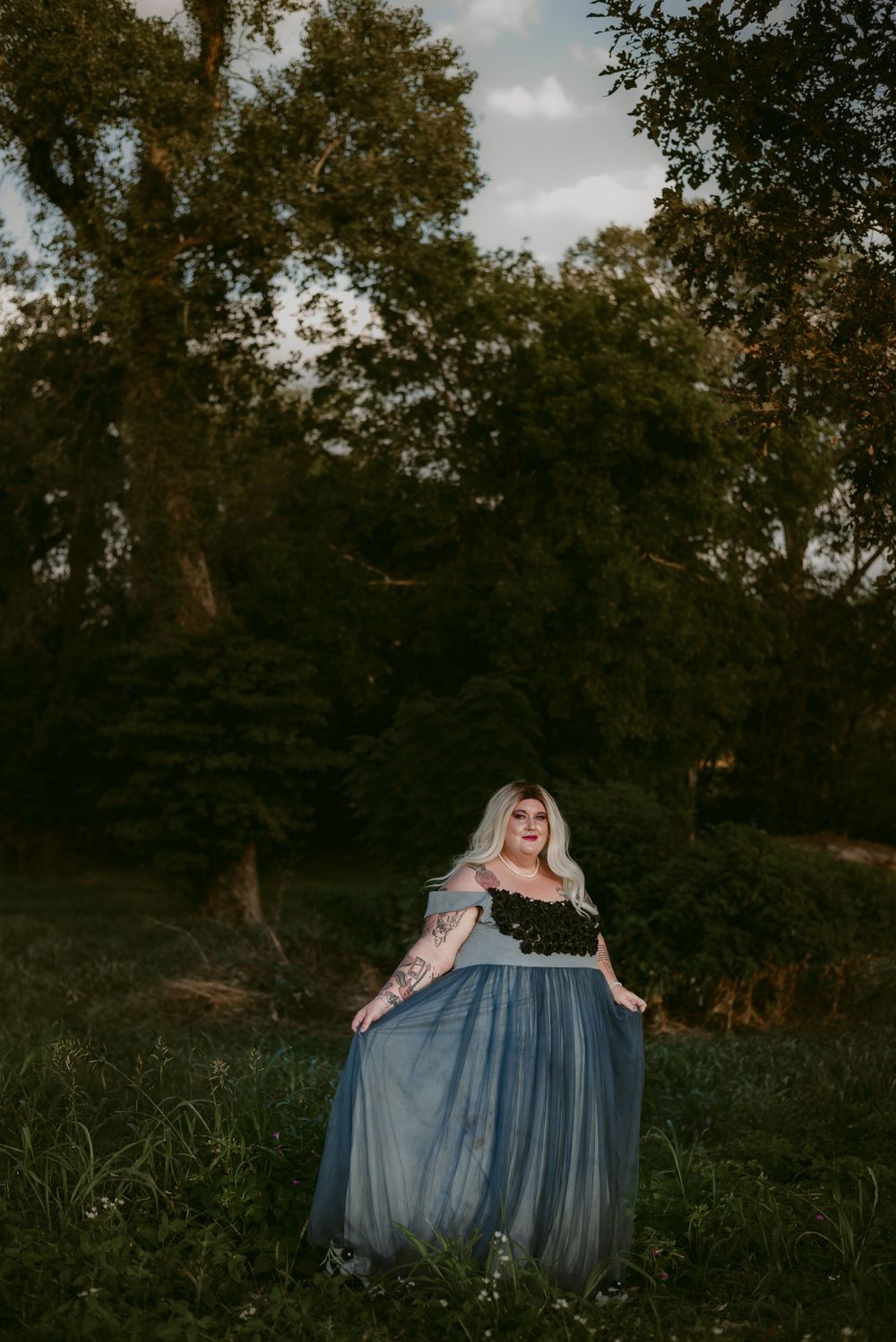Portrait session in a dreamy forest setting with a blue ethereal gown.