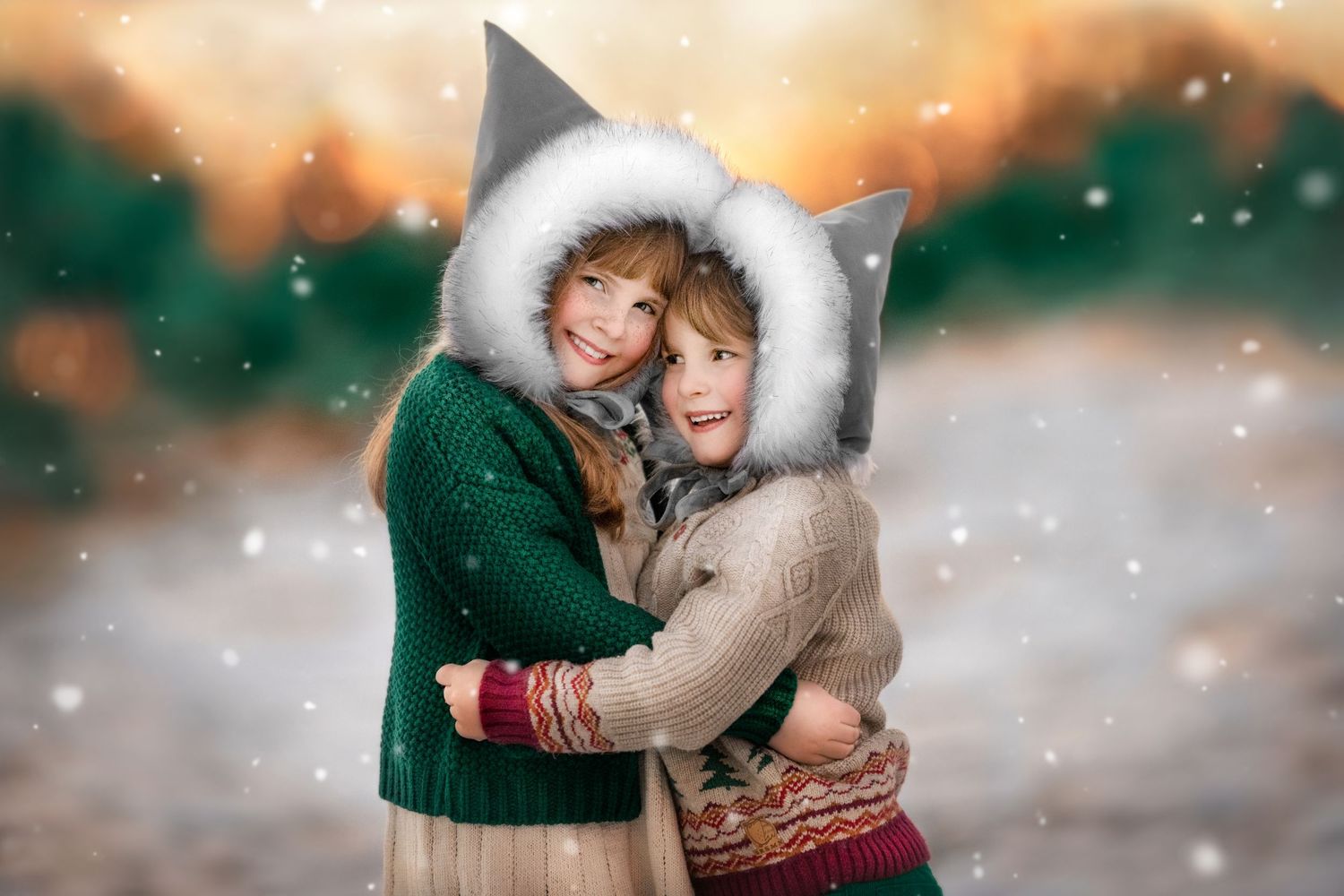 Two children in winter coats with fur-trimmed elf hoods embracing against snowy ethereal winter background.