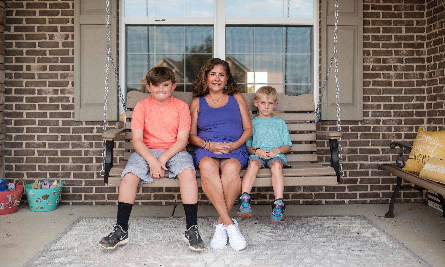 Grandmom and Grandsons on front porch