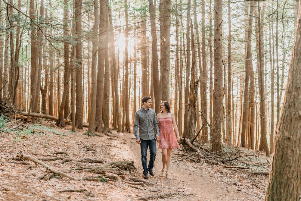 couple walking through magical forest in Vaughan Woods in South Berwick Maine