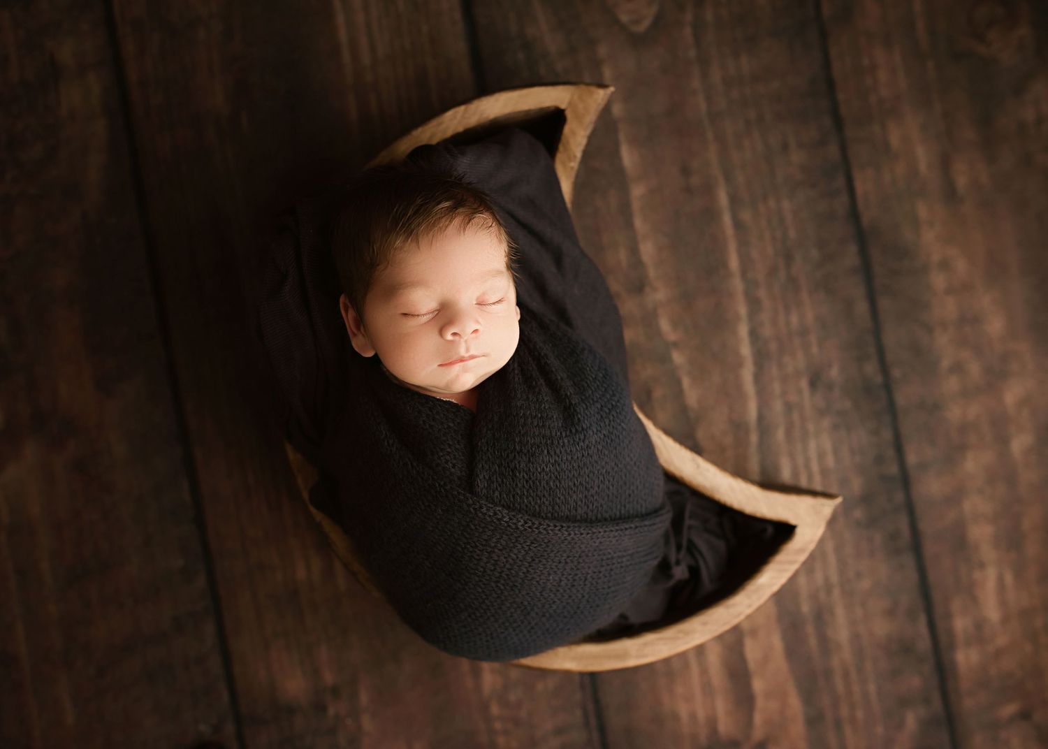 Baby boy in moon bowl prop in Moreno Valley ca newborn photoshoot