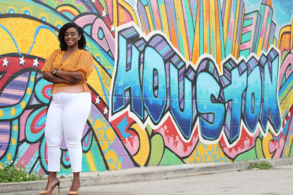 Vibrant graffiti wall background with bright yellow and blue street art.