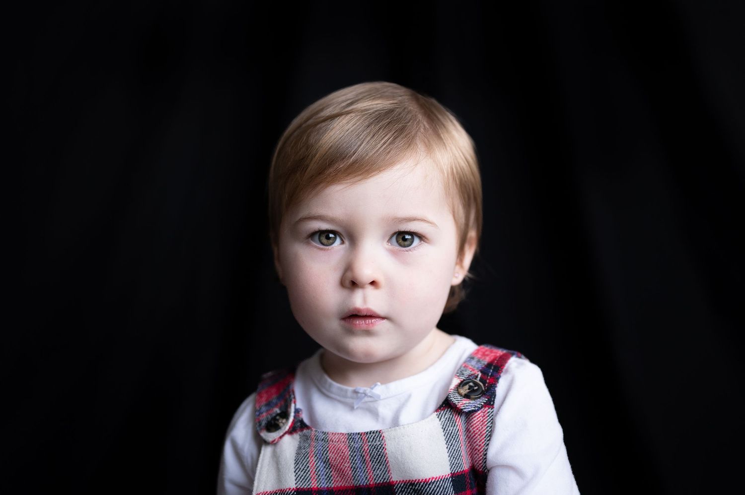 a toddler looks into the camera for a portrait