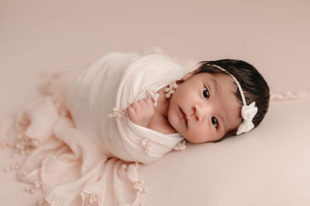 wide awake newborn session with soft pink bloomington normal Illinois photographer