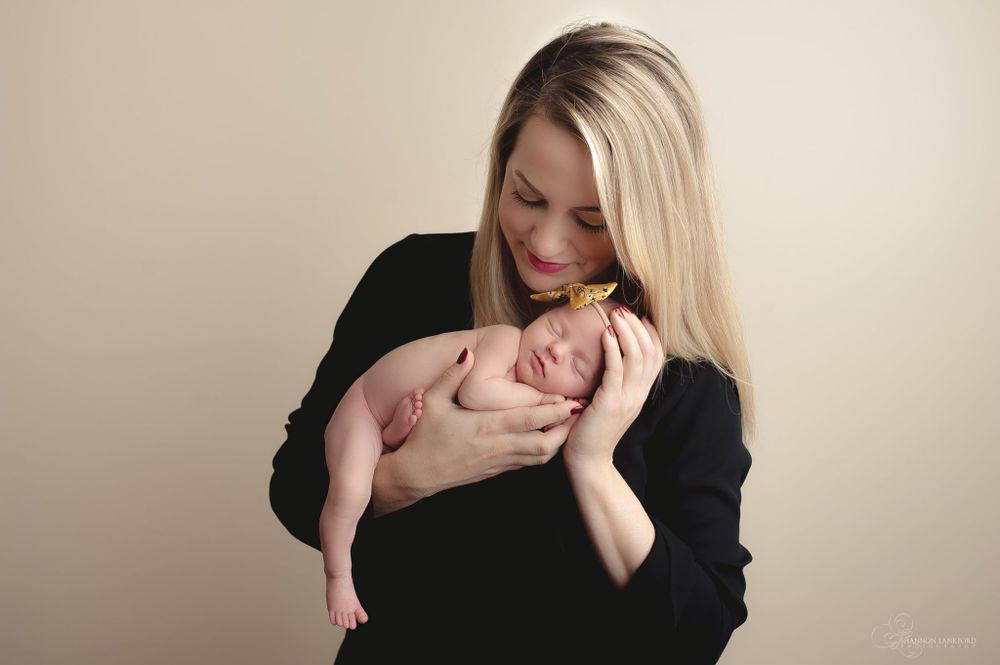 high end newborn photographer specializing in unforgettable classy newborn photos with parents  bloomington normal Il