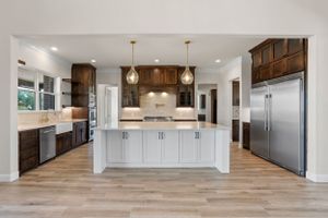 large gourmet kitchen with granite island stained cabinets stainless appliances