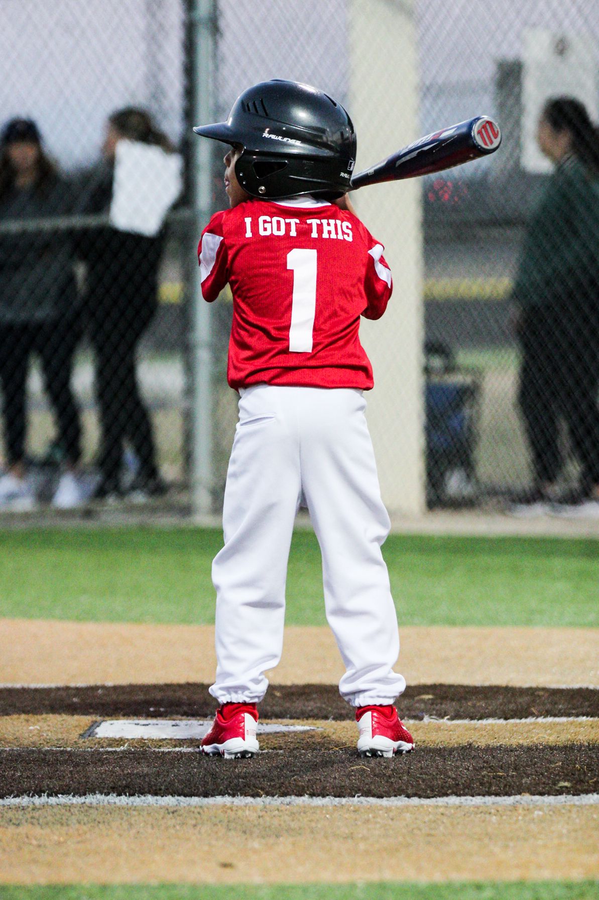 Young baseball player in red jersey with number 1 and text 'I GOT THIS' stands ready at bat.